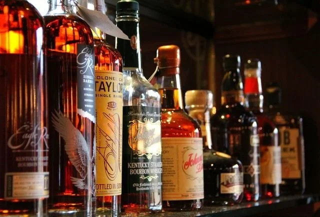 Whiskey bottles on a bar counter